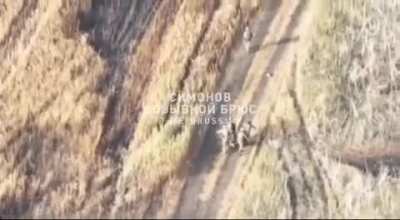 RU POV: Ukrainian medevac group trips up on an unexploded shell while carrying the injured soldier, activating it.