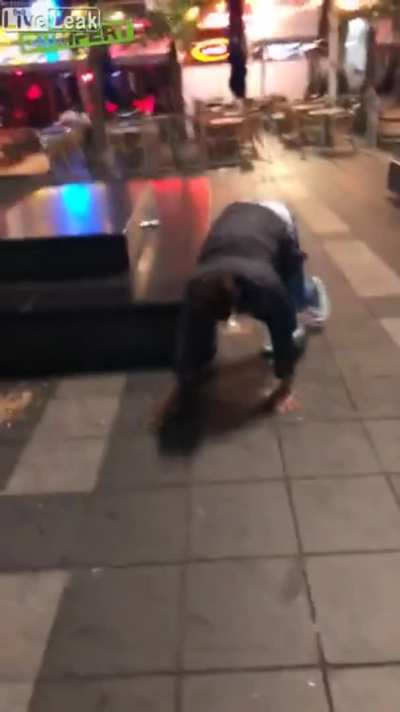 Idiot tries to kick a pigeon and ends up slipping on vomit