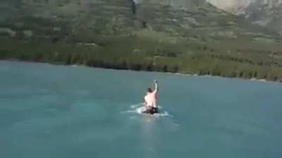 Canadian man jumps on a moose