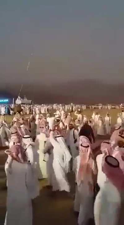 Arab men firing into the sky