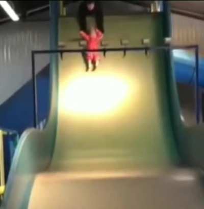 Just a kid sliding down a slide...