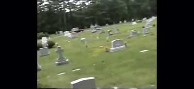 Merle Allin (GG Allin’s brother) smashing a guitar over a man’s head who just puked and pissed on gg’s grave…