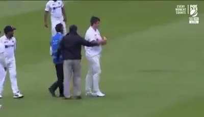 English fan trying to blend in with players wearing Indian jersey.
