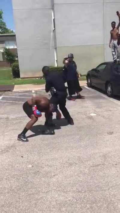 Cop on a street boxing fight