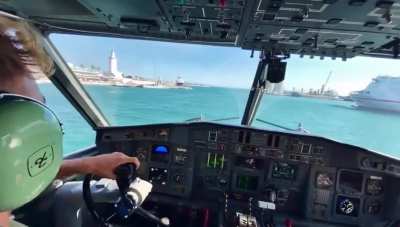 Cockpit view of firefight pilots picking up water
