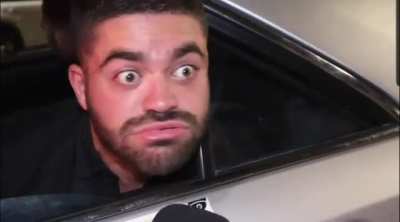 Vlogger tries to interview a guy probably on drugs.