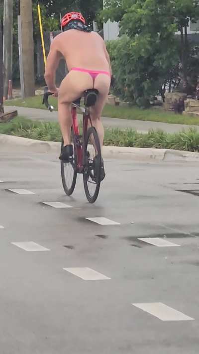 Fort Lauderdale Florida man casually biking in a thong. 