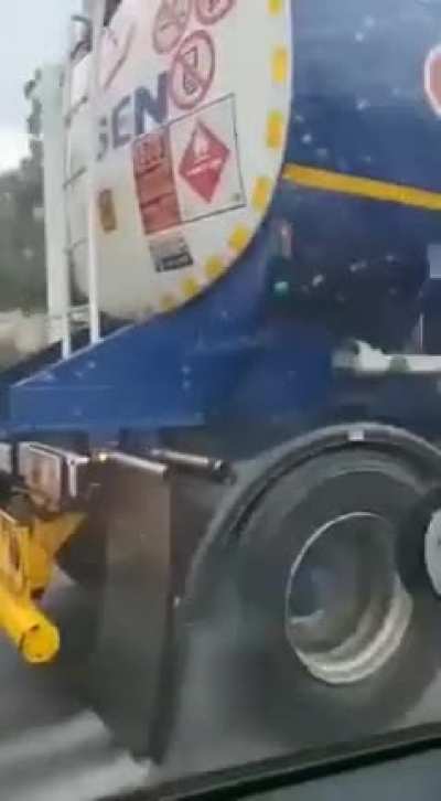 Crazy man catching a lift. Who needs a vehicle!?