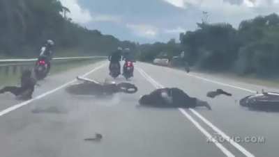 Big guy crashes motorcycle and rolls a little