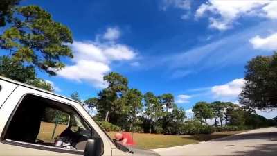 Man in red shirt gets a shot of the Hot Sauce from Bicyclist
