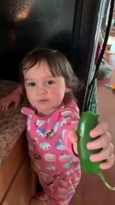 Kid chews a jalapeno like its a carrot
