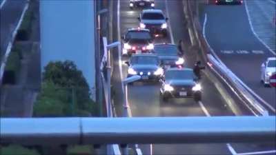 The Japanese Prime Minister's motorcade merging into traffic with a flourish