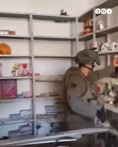Israeli soldier destroys children's toys in Gaza