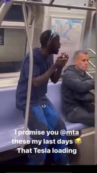 A typical 21st century commute on the NYC subway
