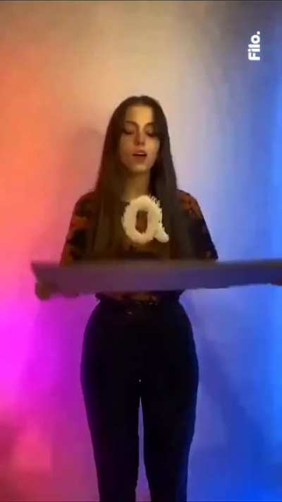 Girl does Rap god lyrical with sand and rice grains.
