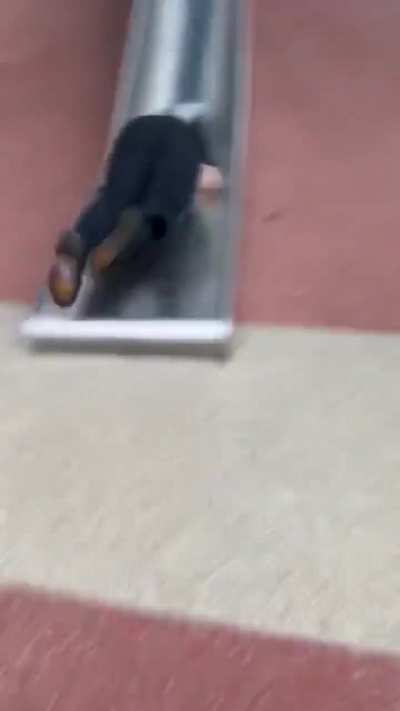 Officer brown use a slide that is made for kids