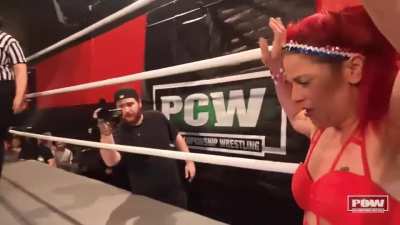 Jordan Blu lands crotch first into the turnbuckle as Lady Lindsay evades