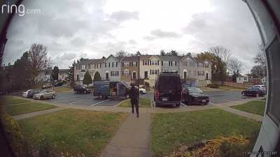 Amazon driver won’t let rain ruin his vibe