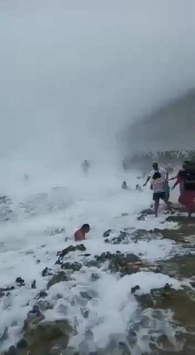Beachgoers get washed away