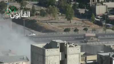 Life & traffic goes on around a Syrian Army T-72 laying rounds into Opposition held neighborhoods in Qaboun, Damascus - 6/23/2013