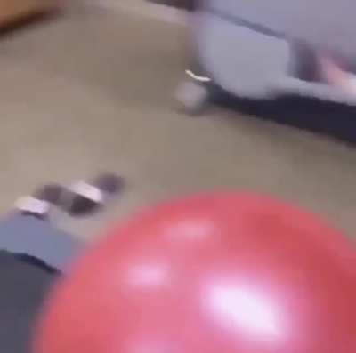 Rolling a yoga ball on a treadmill