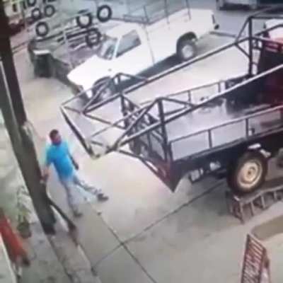 Man barely escapes with his life after truck rolls off ramps. Crazy reflexes, stay safe everyone.