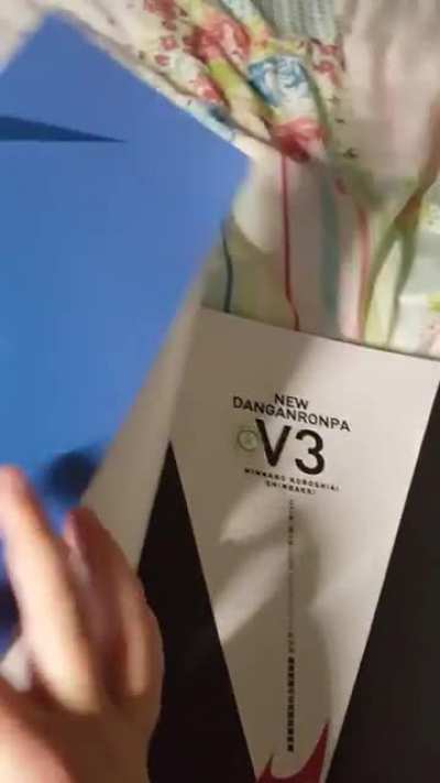 My v3 artbook arrived and my Ma was curious about the cover so she tried to take it off and you can imagine our reactions