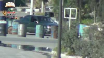 An Army of the Muslims Brigade sniper shoots at an alleged Syrian Army Officer while he driving his car Damascus (March 2013)