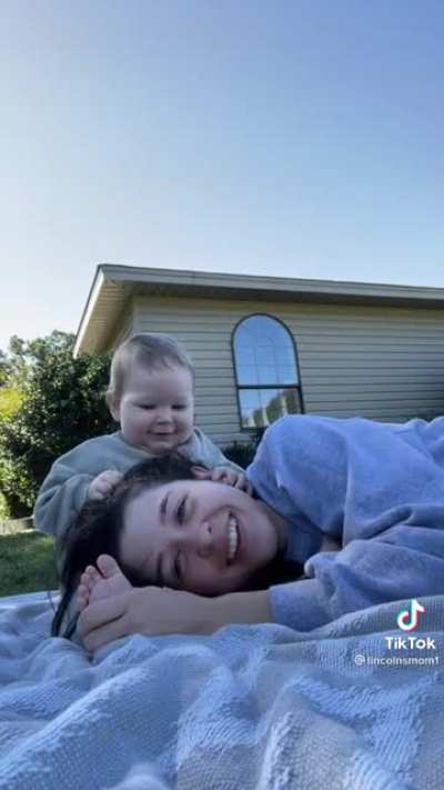 Laying head in baby’s lap