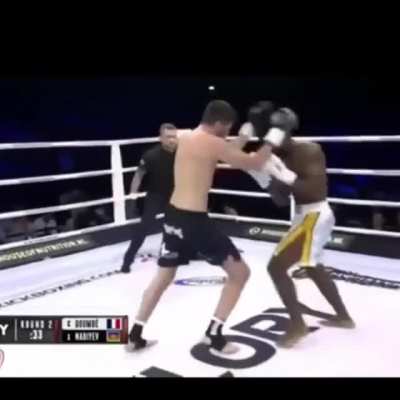 Cédric Doumbé counters the knee to the body.