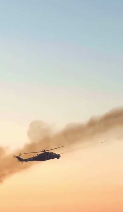 Ukrainian MI-24 fires a salvo of unguided missiles at Russian positions.