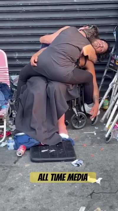 Flies cover the crotch of passed out junkie