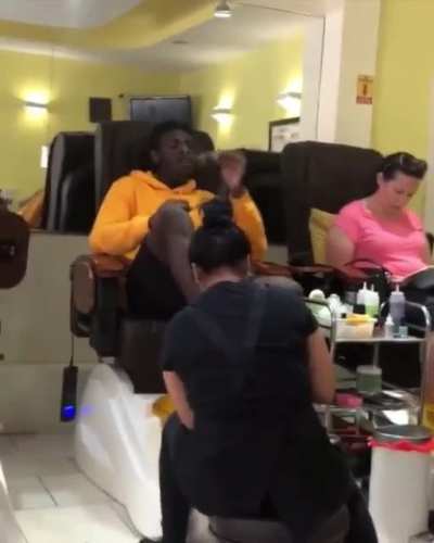 Guy continues to smoke a blunt inside a nail salon after being asked to stop…