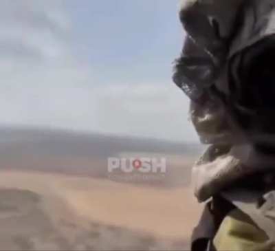 Israeli Bedouin scouts riding in a helicopter near Southern Israel (anyone know what song it is?)