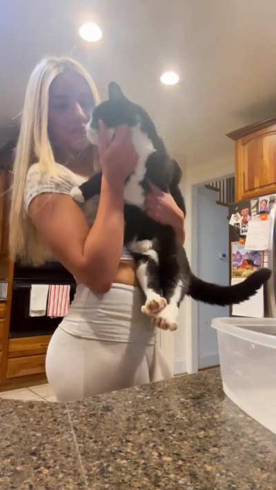 I like the way she strokes her kitty.