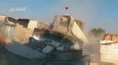 An Israeli D9S bulldozer knocks down a wall only to come face to face with a Hamas RPG team, which plants a rocket into the operator's cab. West of Khan Yunis, Gaza.