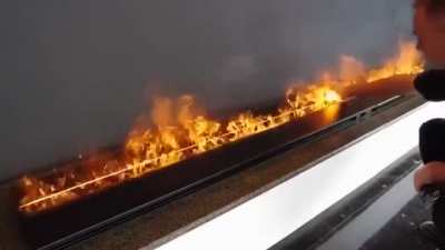 These flames are touchable. They are not even flames, actually as they are made by water vapor lit by LED lights