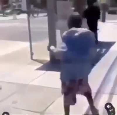 black guy pinches air and falls to the ground