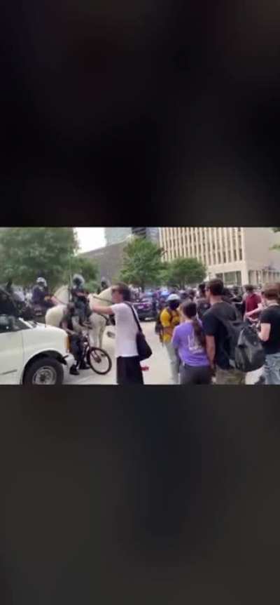 Mounted cop tramples a protester for sport.