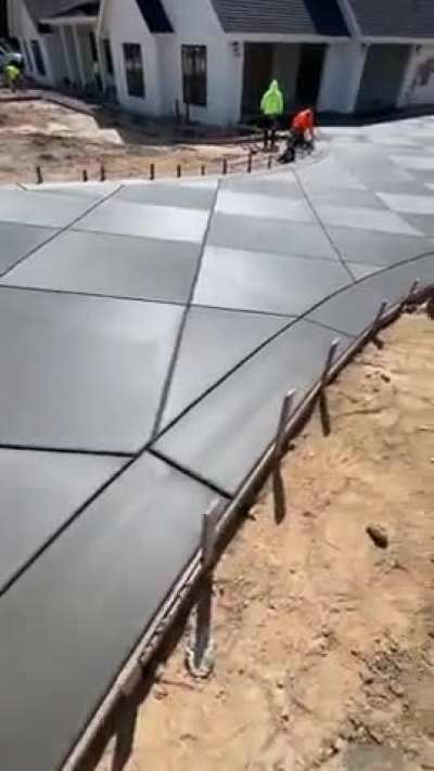 Freshly poured diamond-pattern driveway
