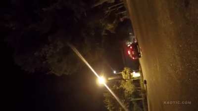 Reckless driver runs over biker in parking lot.