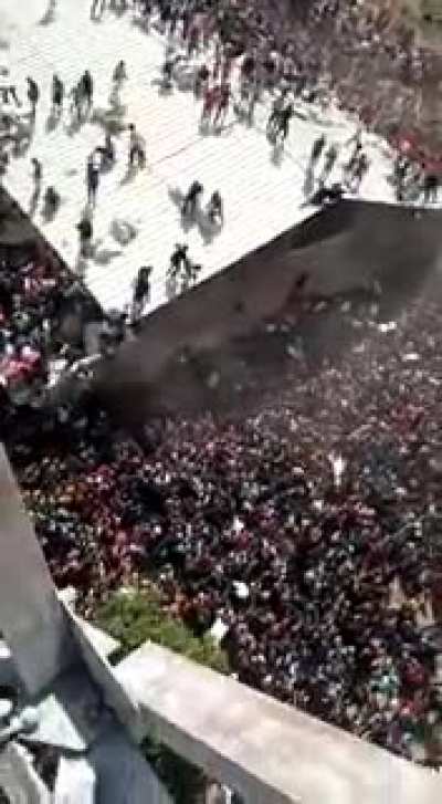 Aerial view of stampede for Palliatives stored in a warehouse in Jos, Plateau state. Cars lined for miles, engulfed in a sea of people, all clamouring to get their share. Hard to watch.