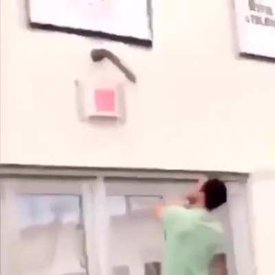 Desperately trying to get this massive dildo off this school gym’s wall