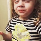 This little girl pretending to like mommy’s cooking