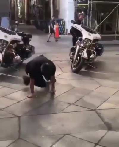 Hip hop battle between kid and cop