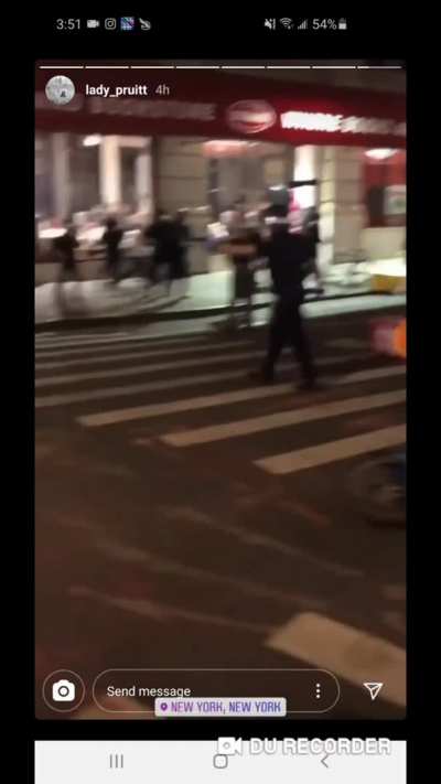 NYPD officers pulls gun on protestors filming an arrest