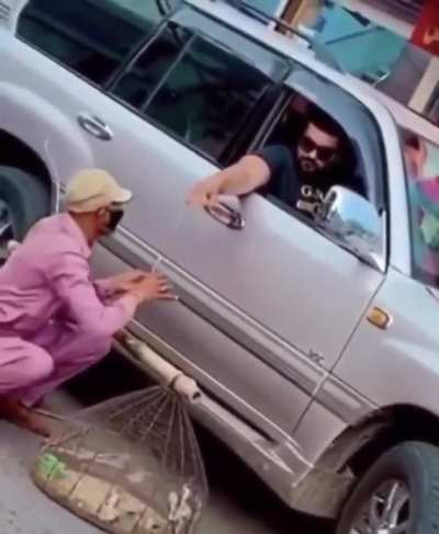 This man is buying birds to set them free.