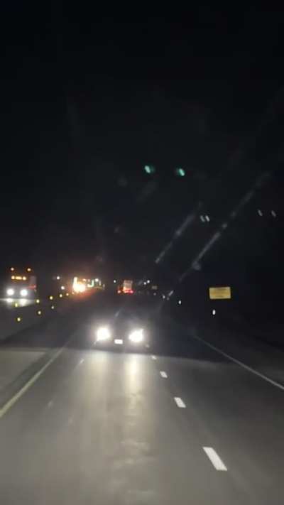 Wrong way driver points gun at trucker.