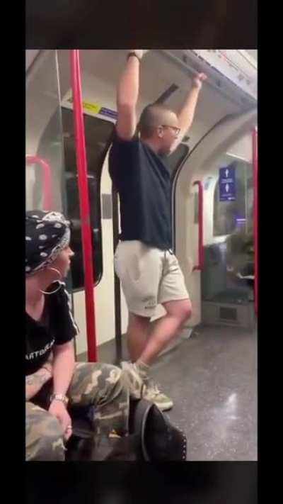 Man is being racist on the tube. Gets absolutely LAMPED