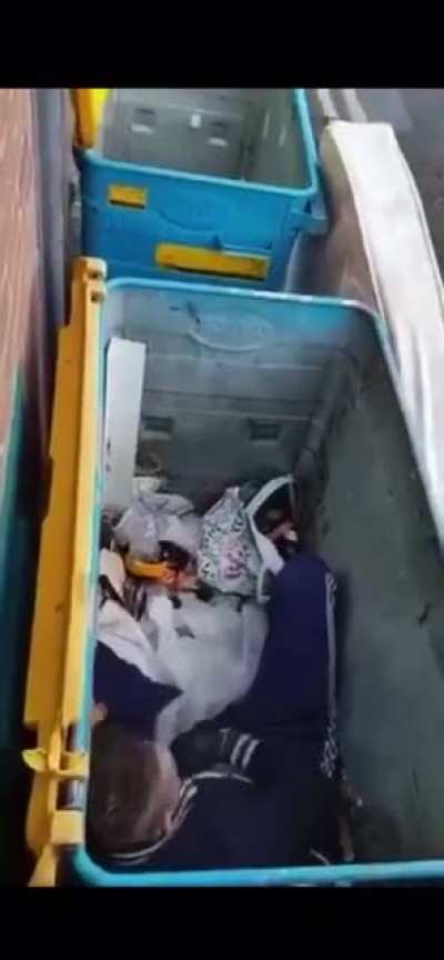 Some bloke lying in a bin talking to himself after doing pills &amp; powder